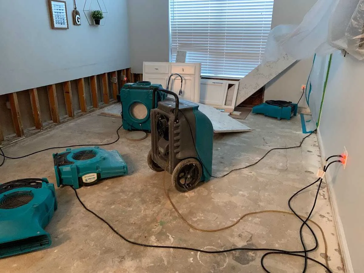 Dehumidifier in flood-cut room for Water Damage Restoration in Ellington